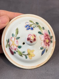 A Chinese famille rose teapot and cover with floral design and three cups, Qianlong