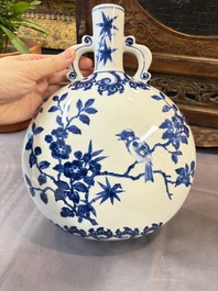 A Chinese blue and white moonflask vase and a wucai garlic-mouth bottle vase, Yongle and Wanli mark, 20th C.