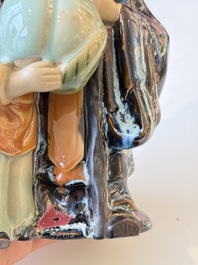 A Chinese polychrome-glazed Shiwan stoneware figure of Tudigong, a 'Shoulao' group and a 'Go Players' group, China marks, 19/20th C.