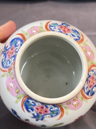 A Chinese famille rose teapot and cover with floral design and three cups, Qianlong