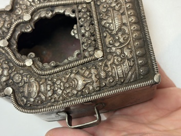 A Tibetan silver and copper Ghau or prayer box, 19th C.