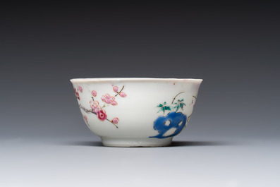 A fine Chinese famille rose cup and saucer with a couple on a terrace, Yongzheng/Qianlong