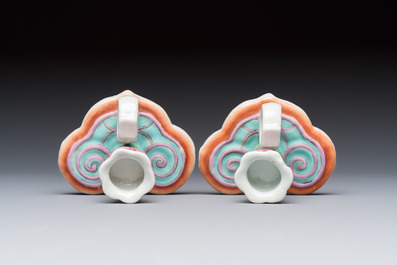 A pair of Chinese export famille rose lotus-form chambersticks on ruyi-shaped bases, Qianlong
