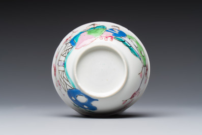 A fine Chinese famille rose cup and saucer with a couple on a terrace, Yongzheng/Qianlong