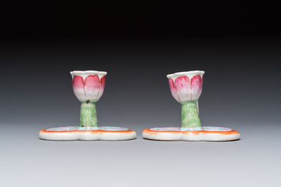 A pair of Chinese export famille rose lotus-form chambersticks on ruyi-shaped bases, Qianlong
