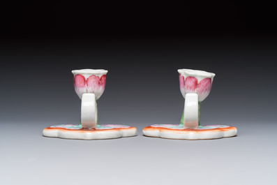 A pair of Chinese export famille rose lotus-form chambersticks on ruyi-shaped bases, Qianlong