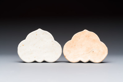 A pair of Chinese export famille rose lotus-form chambersticks on ruyi-shaped bases, Qianlong