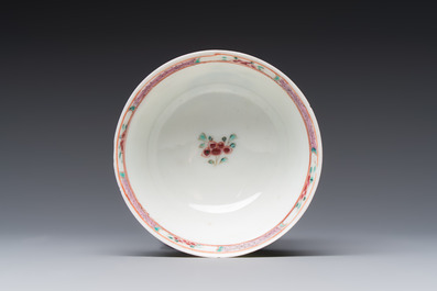 A fine Chinese famille rose cup and saucer with a couple on a terrace, Yongzheng/Qianlong