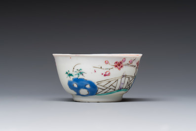 A fine Chinese famille rose cup and saucer with a couple on a terrace, Yongzheng/Qianlong