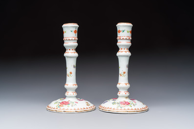 A pair of Chinese famille rose candlesticks with floral design, Qianlong