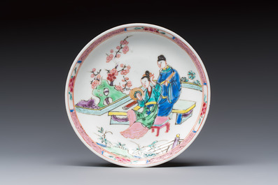 A fine Chinese famille rose cup and saucer with a couple on a terrace, Yongzheng/Qianlong