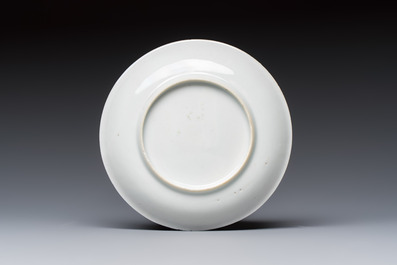 A fine Chinese famille rose cup and saucer with a couple on a terrace, Yongzheng/Qianlong