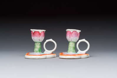 A pair of Chinese export famille rose lotus-form chambersticks on ruyi-shaped bases, Qianlong