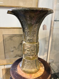 A Chinese archaic bronze wine vessel with Taotie design, Zun 尊, late Shang