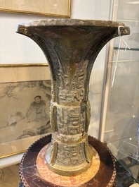 A Chinese archaic bronze wine vessel with Taotie design, Zun 尊, late Shang