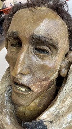 A macabre polychrome life-sized wax sculpture of a deceased monk, Italy, 19th C.