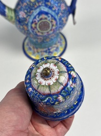 A Chinese Canton blue-ground enamel ewer and cover with floral design, 19th C.