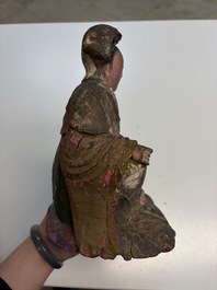 Eight Chinese carved wooden sculptures with traces of polychromy and gilding, 19th C.