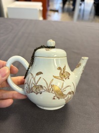 A Chinese gilt-decorated iron-red 'Fei Ming Su Shi 飛鳴宿食' teapot and cover, Qianlong