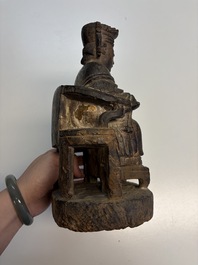Eight Chinese carved wooden sculptures with traces of polychromy and gilding, 19th C.