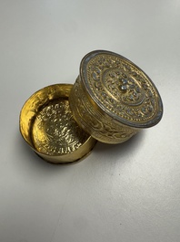 A fine Tibetan gilt-bronze box and cover with repouss&eacute; scroll decoration, 18th C.