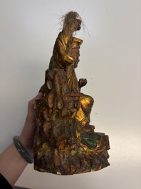 Eight Chinese carved wooden sculptures with traces of polychromy and gilding, 19th C.