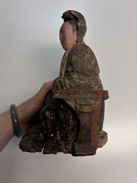 Eight Chinese carved wooden sculptures with traces of polychromy and gilding, 19th C.