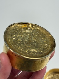 A fine Tibetan gilt-bronze box and cover with repouss&eacute; scroll decoration, 18th C.