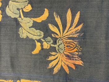 Two Chinese embroidered silk panels with antiquities and birds among flowering branches, 19th C.