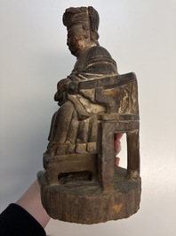 Eight Chinese carved wooden sculptures with traces of polychromy and gilding, 19th C.
