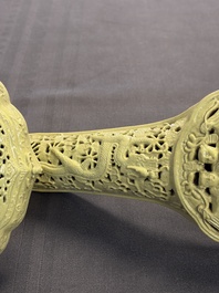 A large Chinese lemon-yellow-glazed biscuit 'Dragons' ruyi in the style of Wang Bingrong, on a wooden stand, Republic