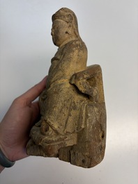 Eight Chinese carved wooden sculptures with traces of polychromy and gilding, 19th C.