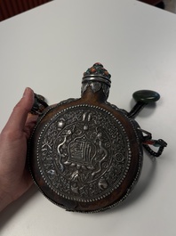 A Tibetan red-coral and malachite-inlaid and silver-mounted 'Ba Ji Xiang' wine bottle, 19th C.