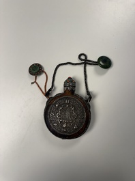 A Tibetan red-coral and malachite-inlaid and silver-mounted 'Ba Ji Xiang' wine bottle, 19th C.