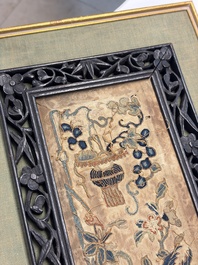 Two Chinese embroidered silk panels with antiquities and birds among flowering branches, 19th C.