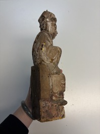 Eight Chinese carved wooden sculptures with traces of polychromy and gilding, 19th C.