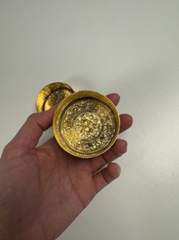 A fine Tibetan gilt-bronze box and cover with repouss&eacute; scroll decoration, 18th C.