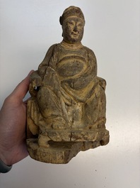 Eight Chinese carved wooden sculptures with traces of polychromy and gilding, 19th C.