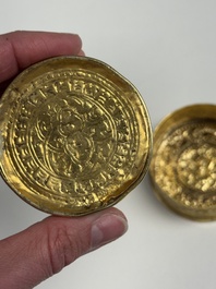 A fine Tibetan gilt-bronze box and cover with repouss&eacute; scroll decoration, 18th C.