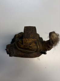 Eight Chinese carved wooden sculptures with traces of polychromy and gilding, 19th C.