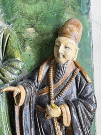 A large Chinese sancai-glazed architectural tile with two figures, Ming