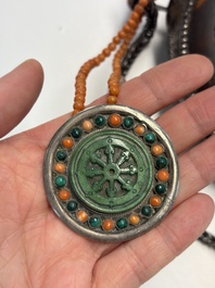 A Tibetan red-coral and malachite-inlaid and silver-mounted 'Ba Ji Xiang' wine bottle, 19th C.