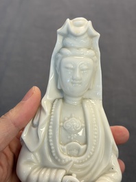 Two Chinese Dehua blanc de Chine groups of Guanyin and a vase with lion-head handles, 18th C. and later