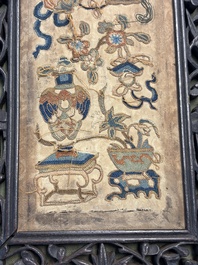 Two Chinese embroidered silk panels with antiquities and birds among flowering branches, 19th C.