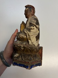 Eight Chinese carved wooden sculptures with traces of polychromy and gilding, 19th C.