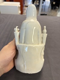 Two Chinese Dehua blanc de Chine groups of Guanyin and a vase with lion-head handles, 18th C. and later