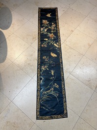 Two Chinese embroidered silk panels with antiquities and birds among flowering branches, 19th C.