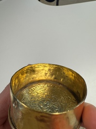 A fine Tibetan gilt-bronze box and cover with repouss&eacute; scroll decoration, 18th C.