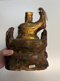 Eight Chinese carved wooden sculptures with traces of polychromy and gilding, 19th C.