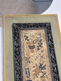 Two Chinese embroidered silk panels with antiquities and birds among flowering branches, 19th C.